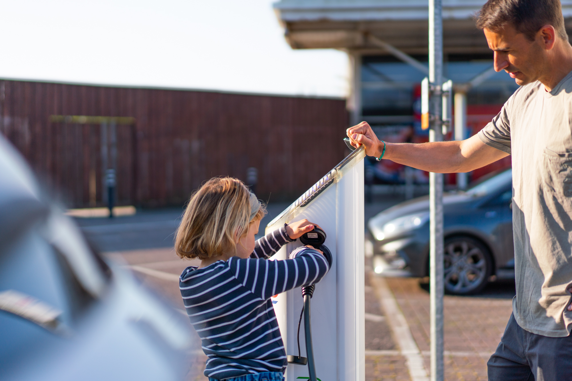 Family Charging an EV at Tesco