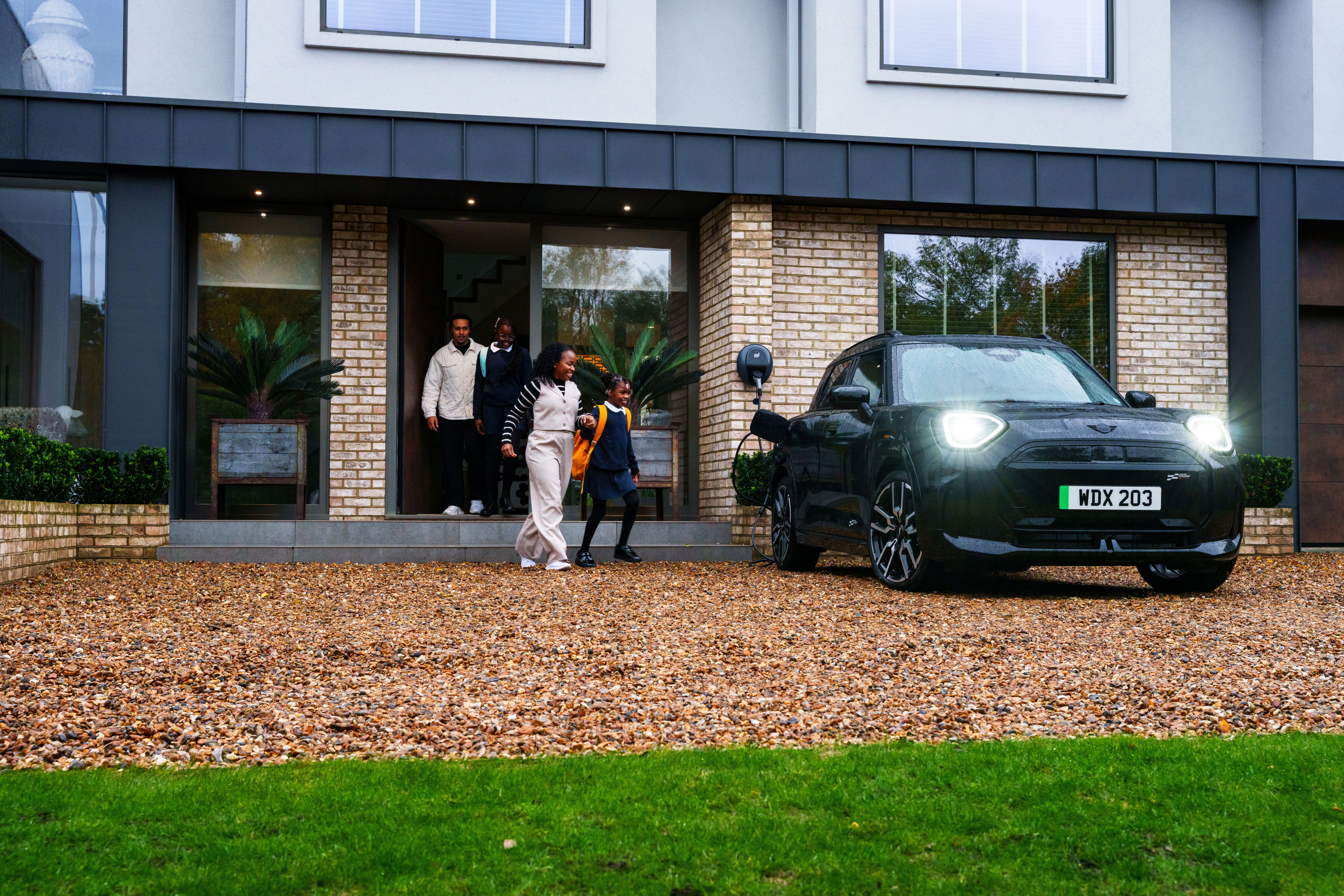 family getting into a fully charged ev.jpg