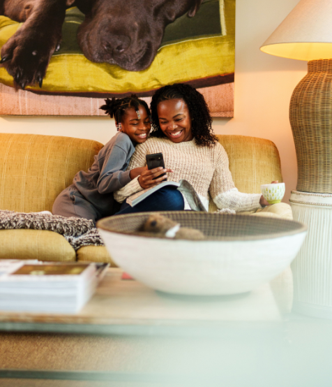 mum and daughter using smartphone