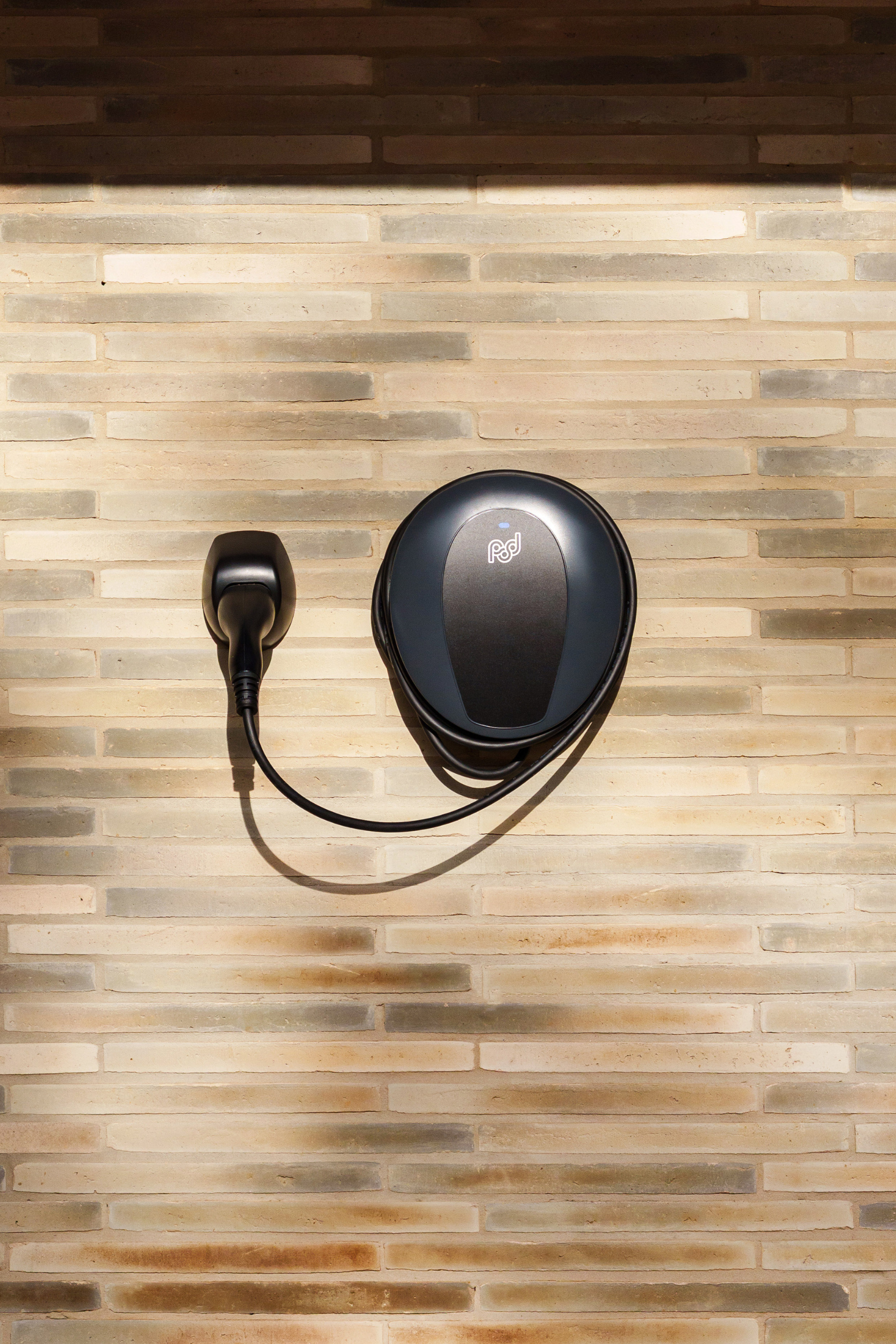 tethered pod point ev charger on wall