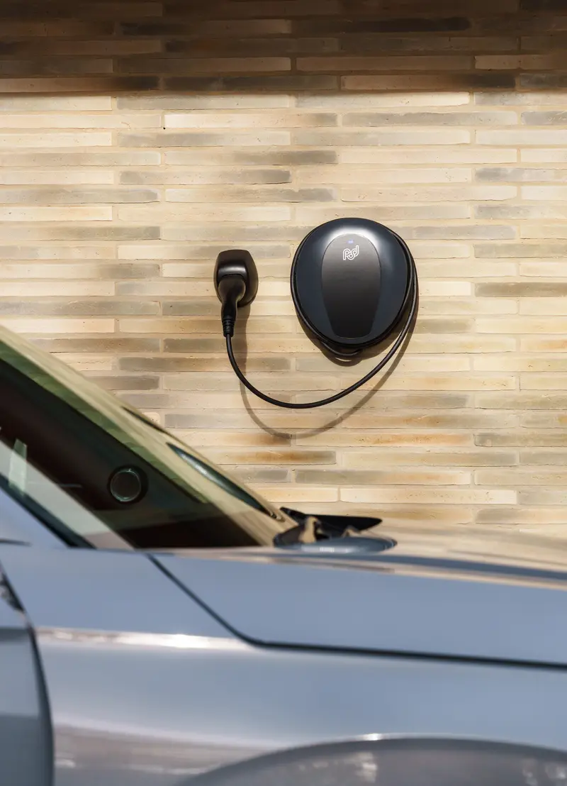 Tethered Pod Point Solo 3S on the side of a house