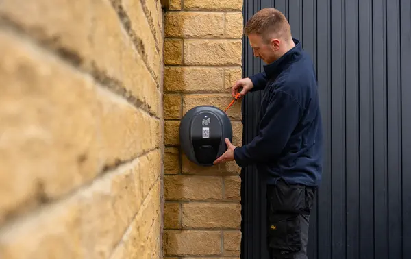 pod engineer carrying out maintenance on pod point ev charger