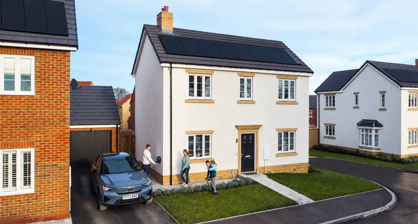 solar powered home with family walking outside