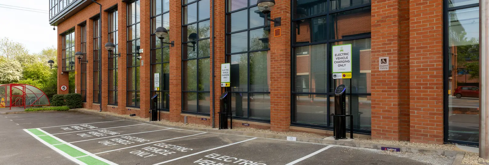 office block with pod point twin chargers in car park
