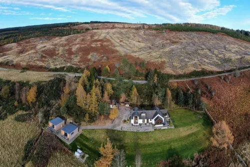 Aerial shot of Ceol Mor lodges showing highland scenery around the estate