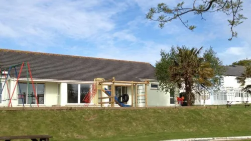 garden of an ivy towers holiday cottage with climbing frame and swings