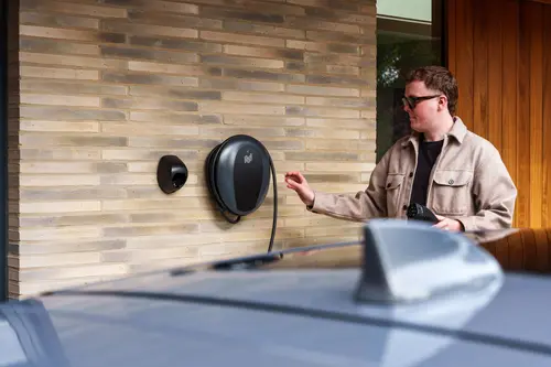 Plugging in a home EV charger